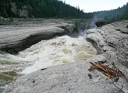 Rapids on Trout River, from Mackenzie Highway61°8′42″N 119°50′46″W / 61.14500°N 119.84611°W / 61.14500; -119.84611