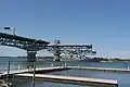 USS Arleigh Burke traveling under the bridge.