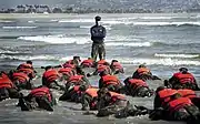 First Phase A Navy SEAL Instructor in Class 245 provides a lesson to his trainees on listening to instruction.