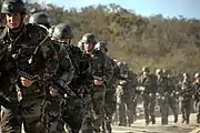 A forced march from the Close Quarters Combat facility.