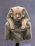 Upper part of portrait statuette of pharaoh Amenemhat III, wearing a nemes, c. 1853 – c. 1805 BCE
