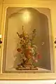 Flowers in a vase with a squirrel