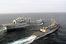 Wave Ruler (background) refuels USS&nbsp;Robert G. Bradley in the Pacific Ocean.