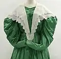 White cotton double pelerine, green silk dress