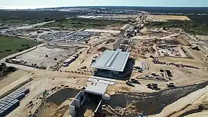 Sandy construction site with concrete station in the middle