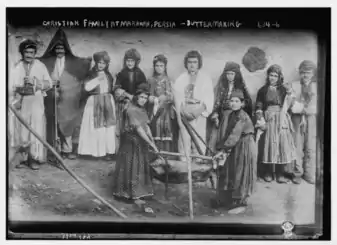 A Mawana Assyrian family making dairy product using sheep skin.